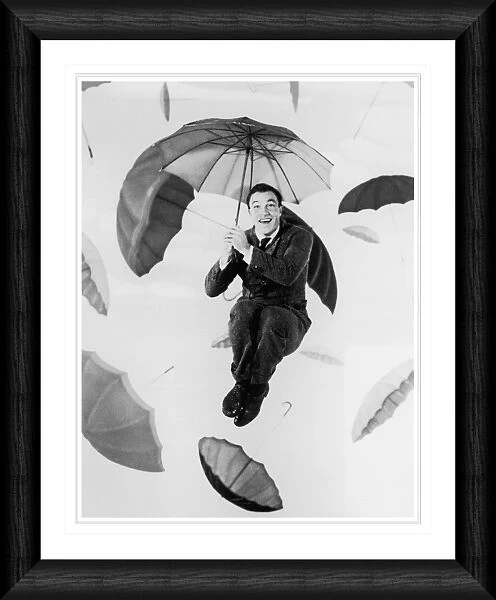 Gene Kelly Umbrellas Framed Print