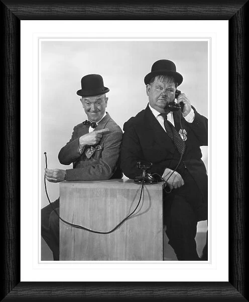 Laurel & Hardy on the Phone Framed Print