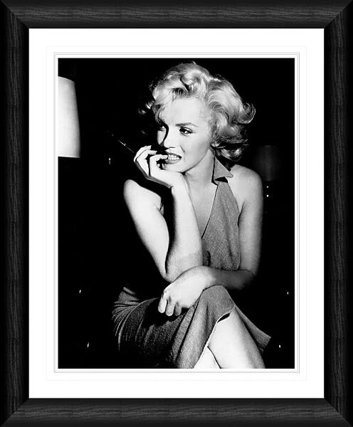 Marilyn Monroe Candid Pose Holding a Cigarette Framed Print