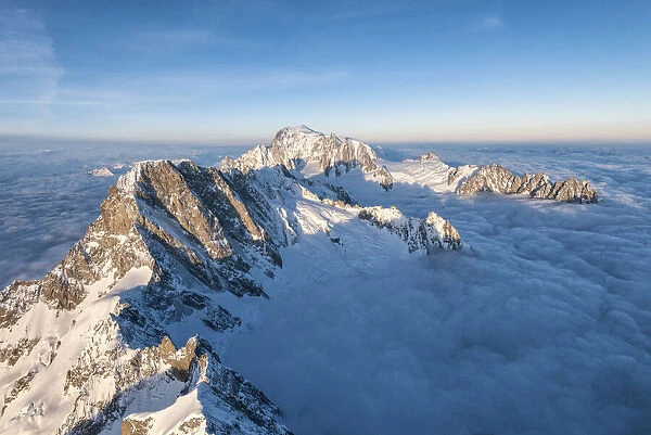 Aerial view of Grandes Jorasses and Mont Blanc in background during sunrise, Courmayeur
