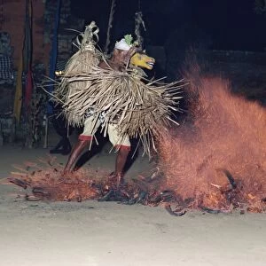 A dancer with an animal mask in a trance performing