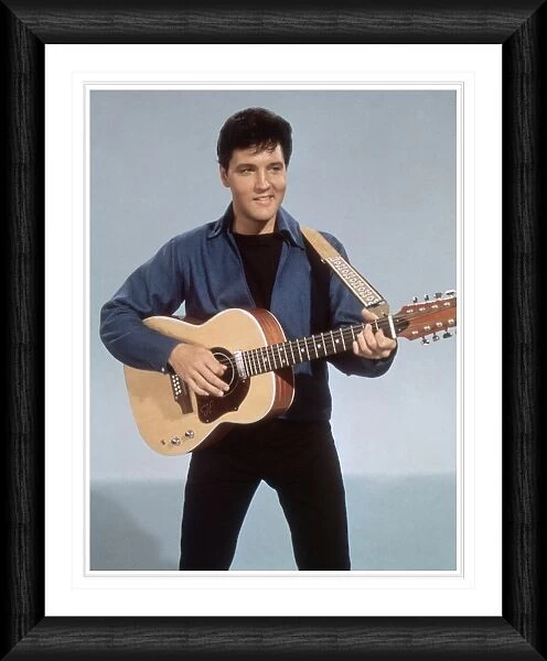 Elvis Presley with a Twelve String Guitar Framed Print