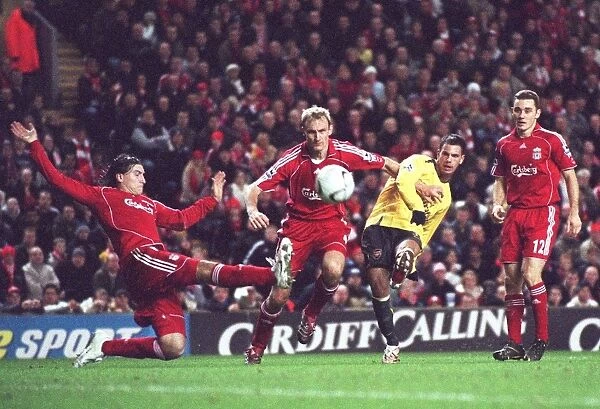 Jermie Aliadiere (Arsenal) shoots under pressure from Sami Hyypia