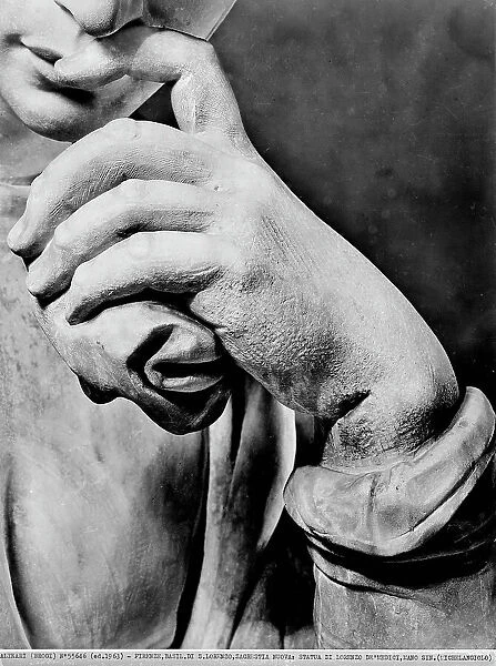 Monument to Lorenzo de'Medici: the hand resting on the lips of the statue, by Michelangelo, in the New Sacristy of the Medici Chapel, Basilica of San Lorenzo, Florence. Photograph taken during the removal of the statue during the Second World War