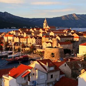 Korcula, view of the fortified town by the sea at sunset, Dalmatia, Croatia