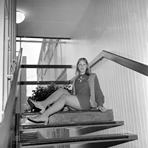 Linda Sewell aged 18 wearing a mini skirt sitting on the steps December 1969